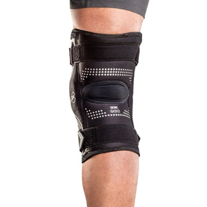Bionic black knee brace with adjustable velcro straps worn on a leg