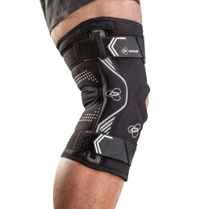 DonJoy Performance black knee brace with adjustable straps worn on a leg