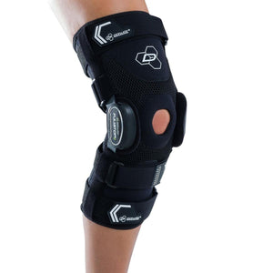 DonJoy black knee brace with adjustable straps and hinge mechanism worn on a leg