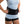 Person wearing a black DonJoy back brace with adjustable side dials
