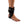 DonJoy black ankle brace worn on a human foot