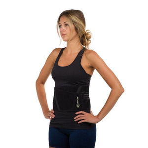 Woman wearing a black DonJoy back support brace over a black tank top