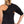 DonJoy black shoulder support brace worn on the left shoulder