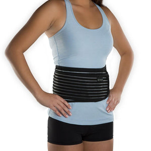 Person wearing a black DonJoy abdominal binder over a blue tank top