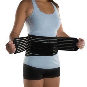 Person wearing a black DonJoy back support brace