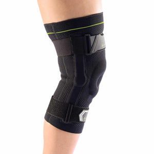DonJoy black compression knee brace with adjustable straps worn on a leg