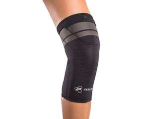 DonJoy black neoprene knee sleeve worn on a leg