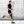 Runner wearing a DonJoy knee brace on his left leg