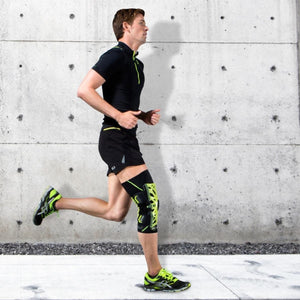 Runner wearing a DonJoy knee brace on his left leg