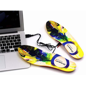 Dr Warm heated insoles with USB cable connected to a laptop