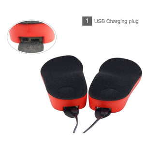 Two red and black heated insoles with USB charging ports visible