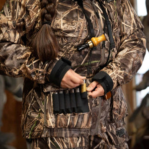 Person wearing DSG Outerwear camouflage hunting jacket with shell holder pocket