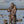 Woman wearing DSG Outerwear camouflage hunting gear standing in water with duck decoys