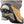Due North traction cleats attached to the sole of a tan work boot