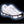 Due North ice traction cleats attached to a white sneaker