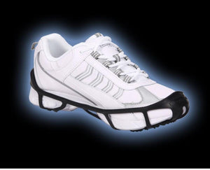 Due North ice traction cleats attached to a white sneaker