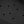 Black textured surface with a repeating hexagonal pattern and evenly spaced circular holes