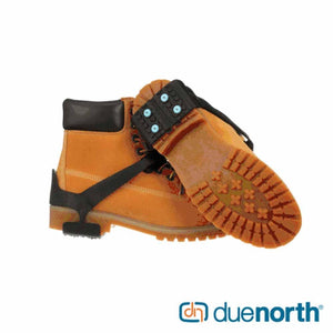 Due North traction aid attached to a tan work boot
