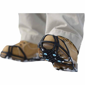Due North ice cleats attached to tan work boots