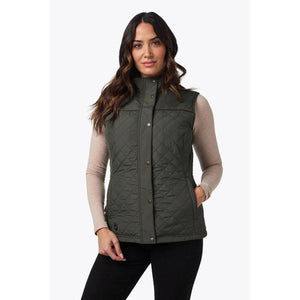 Woman wearing a Mobile Warming olive green quilted vest over a long sleeve shirt