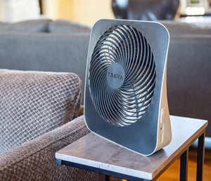 O2 Cool Treva portable desktop fan on a small side table