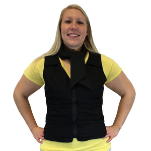 Woman wearing a black Polar Products cooling vest and neck wrap over a yellow shirt