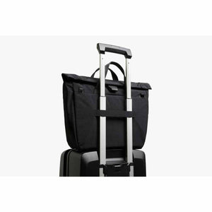 Bellroy black tote bag attached to luggage handle