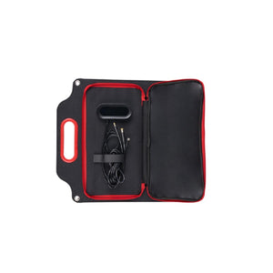 Open black and red portable solar charger case with internal cable storage