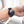 Black Embr Wave thermal wristband worn on a wrist