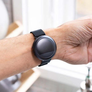Black Embr Wave thermal wristband worn on a wrist