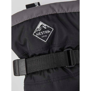 Hestra black glove cuff with adjustable strap and brand logo patch