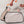 Hands inserting a Chill-Its cooling pack into a mesh vest pocket