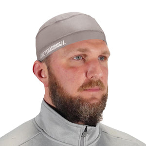 Man wearing a grey Chill-Its cooling skull cap with Be Tenacious branding