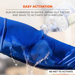 Water being poured from a bottle onto a blue cooling fabric sleeve to activate it