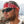 Man wearing a red paisley bandana and black sunglasses