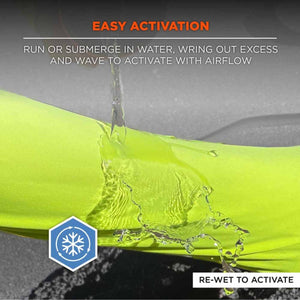 Water being poured over a neon yellow cooling towel with activation instructions