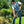 Man wearing a Chill-Its cooling vest while digging in a garden