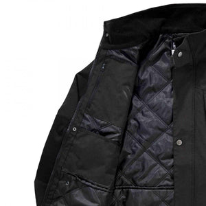 Interior view of black N-Ferno quilted jacket with zipper and snap button closure