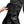 Hand opening a black cargo pocket on work trousers