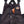 N-Ferno bib overalls featuring a zippered chest pocket with a smartphone inside and Ergodyne logo