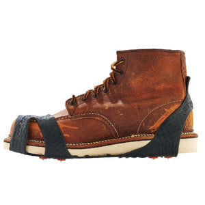 Trex traction cleats attached to a brown leather work boot