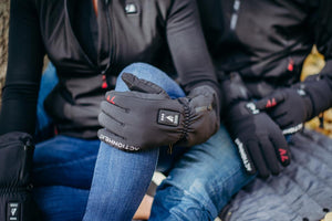 Person wearing black ActionHeat battery powered heated gloves