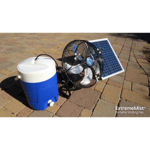 ExtremeMist portable misting fan with water cooler and solar panel on stone patio