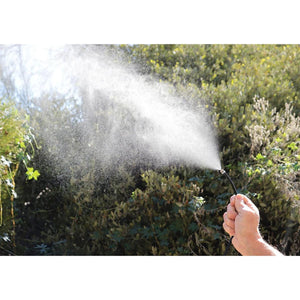 ExtremeMIST handheld mister nozzle spraying fine water mist outdoors