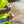 ExtremeMIST cooling system nozzle spraying a fine mist while held by a person in a high visibility vest