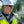 Worker wearing hard hat and high visibility vest using ExtremeMist cooling system
