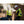 Worker wearing ExtremeMIST cooling vest spraying water mist while working outdoors