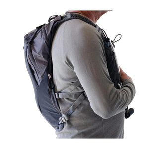 Side view of a person wearing an ExtremeMIST hydration backpack
