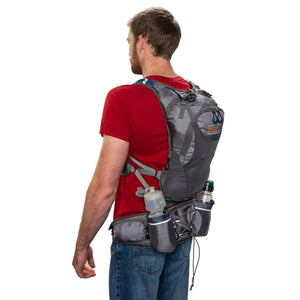 Man wearing a grey ExtremeMist hydration backpack with water bottles in side pockets