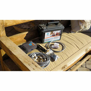ExtremeMist portable misting system kit with hoses and accessories on a wooden bench